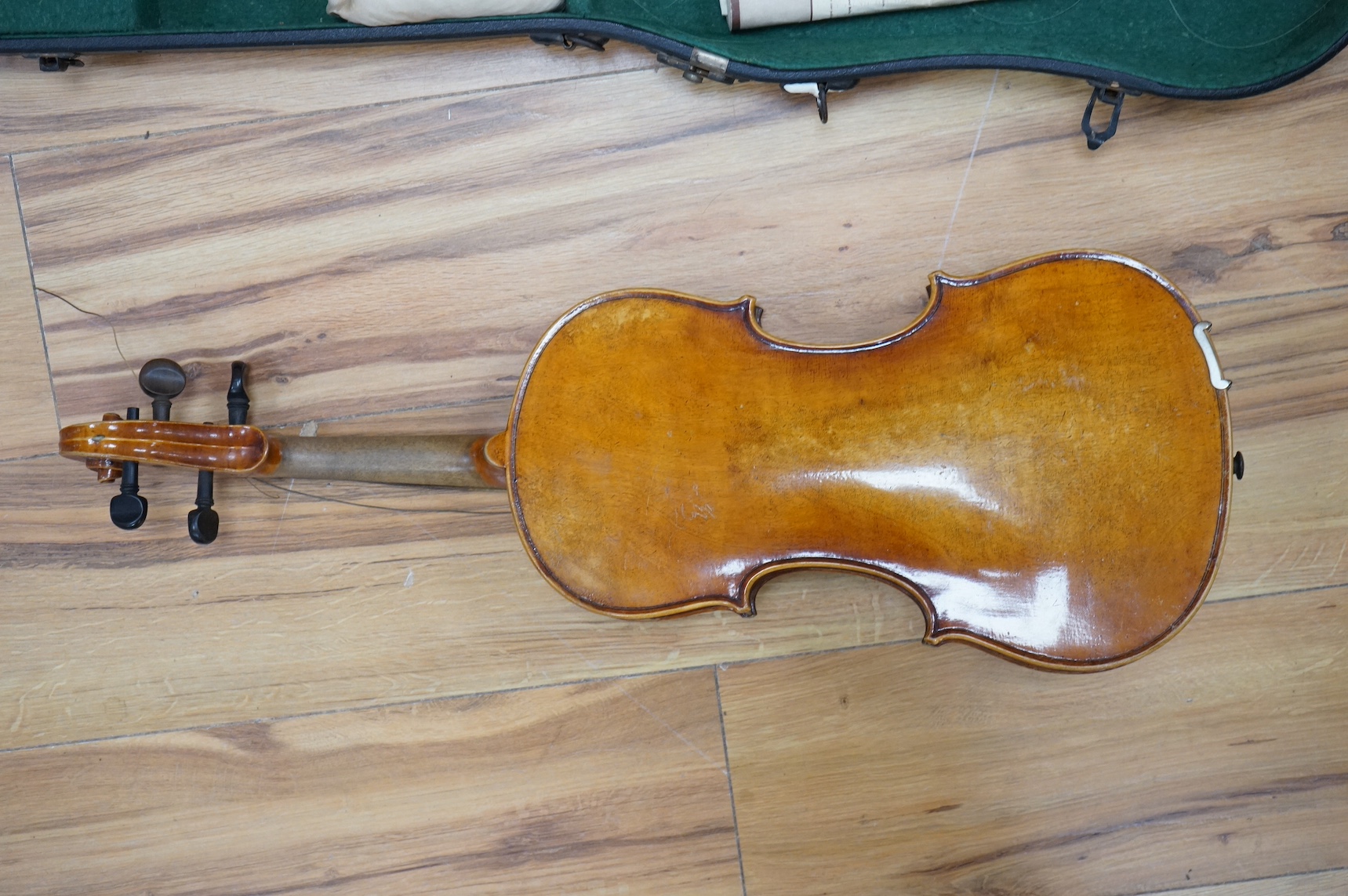 A cased full length violin, circa 1900, with bow, bears Stradivarius label to the interior. CITES Submission reference WVME8714